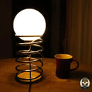 Lampe de chevet ressort