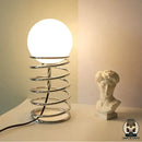Lampe de chevet ressort